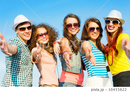group of young people wearing sunglasses and hat group of young people wearing sunglasses and hat 10455622