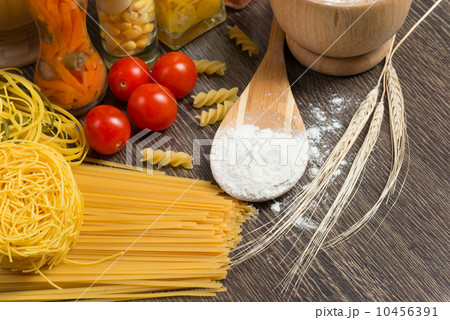 pasta, tomatoes and flour on the spoon pasta, tomatoes and flour on the spoon 10456391