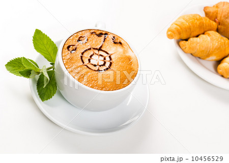 large cup of coffee and croissants on a plate 10456529