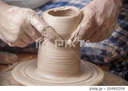 Hands of a potter 10460204