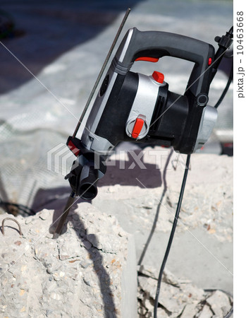 Hammer drills in concrete brick 10463668
