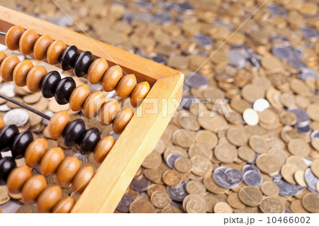 Accounting abacus and heap of coins Accounting abacus and heap of coins 10466002