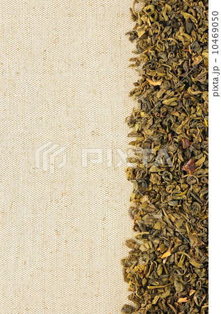 Dry green tea leaves on a sackcloth 10469050