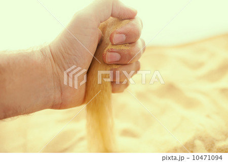 Sand strewing from hand Sand strewing from hand 10471094