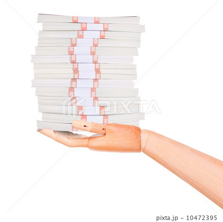 big packs of dollars in wooden hand isolated  10472395