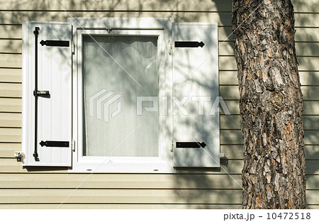 Window with wooden shutters Window with wooden shutters 10472518