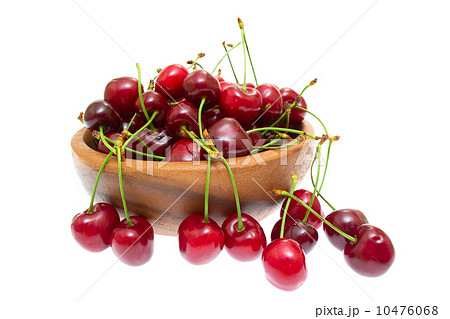 Cherry in wooden bowl isolated on white background 10476068
