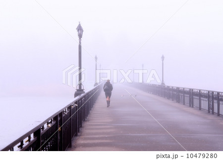 A lonely lady crossing a bridge 10479280