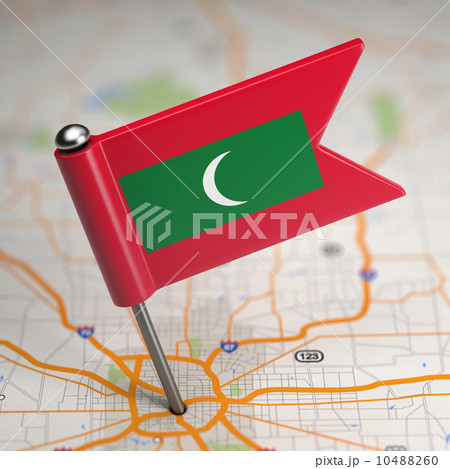 Maldives Small Flag on a Map Background. 10488260