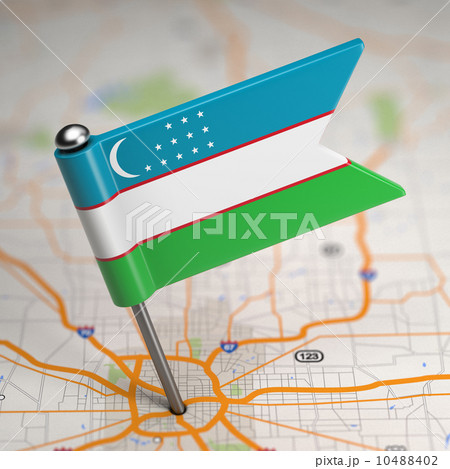 Uzbekistan Small Flag on a Map Background. 10488402