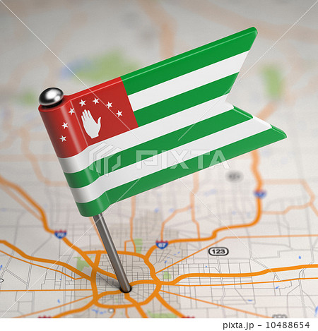 Abkhazia Small Flag on a Map Background. 10488654