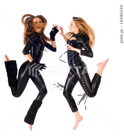 Two pretty girls jumping 10490240