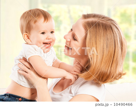 happy family. Mother and baby daughter laugh and embracing happy family. Mother and baby daughter laugh and embracing 10490466