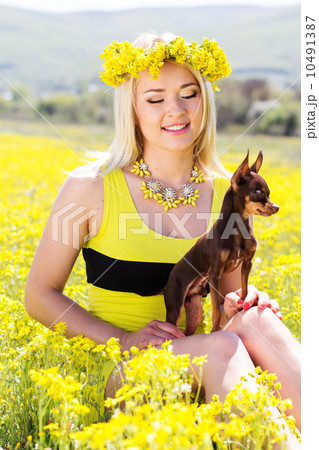 Pretty girl on the nature with her dog Pretty girl on the nature with her dog 10491387