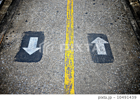 Two way sign on concrete walkway 10491439