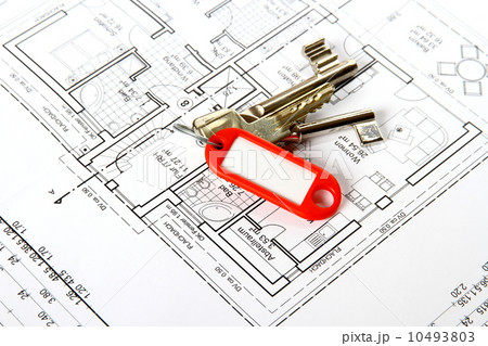 Bunch of keys with red keychains at building drawing 10493803