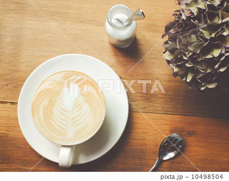 Cappuccino or latte coffee on table with retro filter effect 10498504