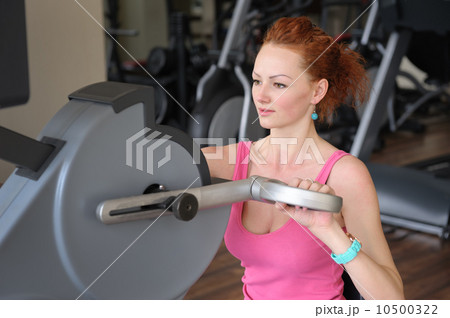 girl doing hands spinning machine workout 10500322