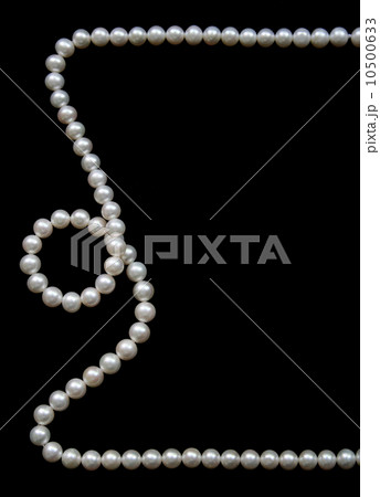 White pearls on the black velvet  background 10500633