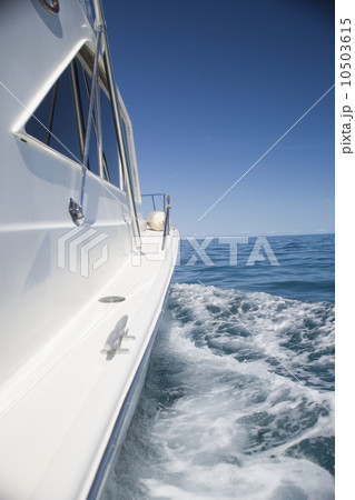 Side of a speed boat and its wake 10503615