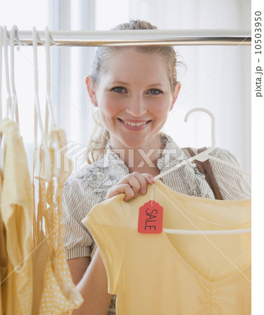 Young woman in clothes shop Young woman in clothes shop 10503950