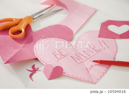 Home-made valentine next to scissors Home-made valentine next to scissors 10504016