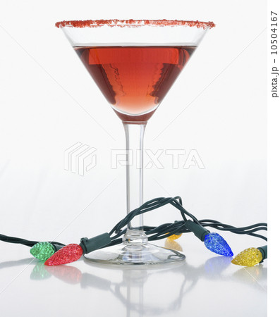 Christmas lights around cocktail glass Christmas lights around cocktail glass 10504167