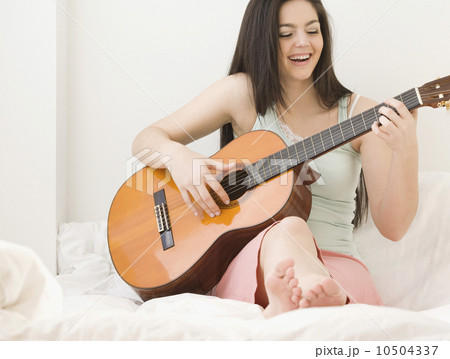 Woman playing guitar 10504337