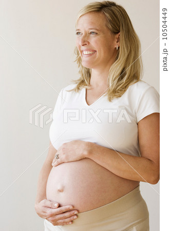 Pregnant woman with hands on belly Pregnant woman with hands on belly 10504449