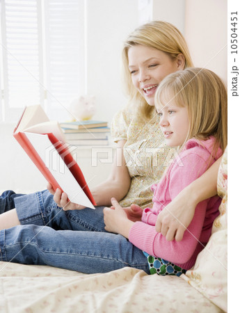 Mother reading to daughter 10504451