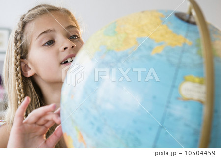 View of girl (8-9) with globe View of girl (8-9) with globe 10504459