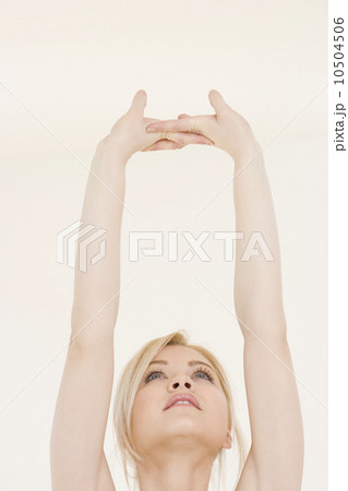 Woman stretching hands over head Woman stretching hands over head 10504506