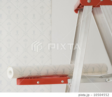 Roll of wallpaper on ladder shelf Roll of wallpaper on ladder shelf 10504552