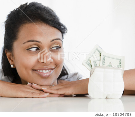 Woman looking at money 10504703