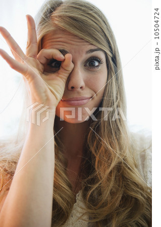 Portrait of blonde woman showing ok sign Portrait of blonde woman showing ok sign 10504724