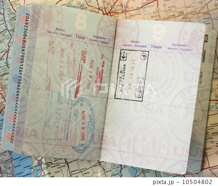Close-up of passport on map Close-up of passport on map 10504802