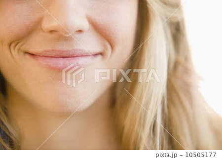 Close up of mouth of smirking woman 10505177