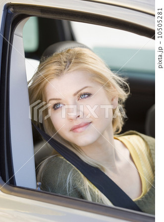 Woman sitting in passenger side of car Woman sitting in passenger side of car 10505281