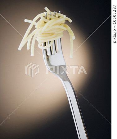 Close up of fork with spaghetti on black background Close up of fork with spaghetti on black background 10505287