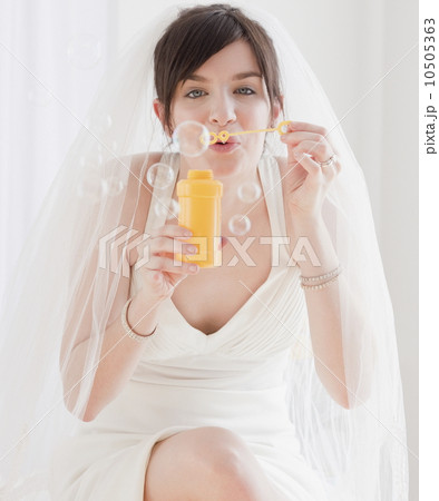 Portrait of bride blowing bubbles Portrait of bride blowing bubbles 10505363