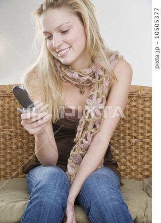 Woman using mobile phone Woman using mobile phone 10505377