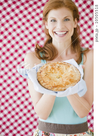 Woman holding a freshly baked pie 10505518