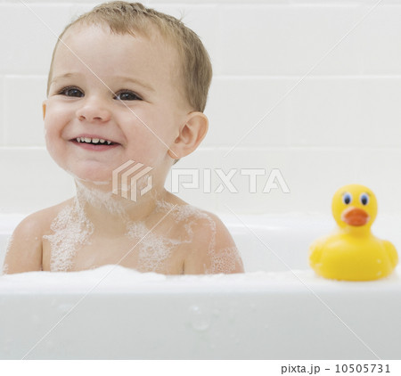 Baby and rubber duck in bath 10505731