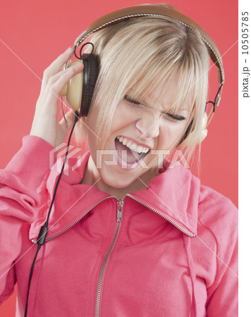 Woman listening to music with headphones 10505785