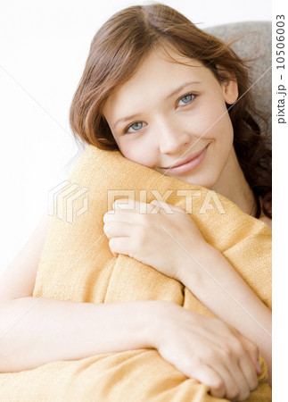 Teenage girl hugging pillow Teenage girl hugging pillow 10506003