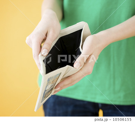 Woman holding open empty wallet Woman holding open empty wallet 10506155