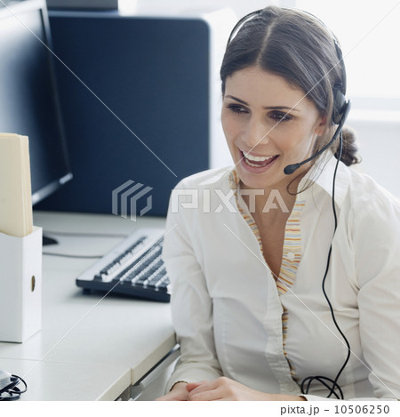 Businesswoman wearing headset Businesswoman wearing headset 10506250
