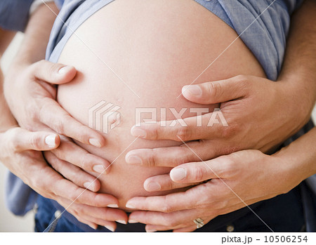 Young man hugging pregnant woman 10506254