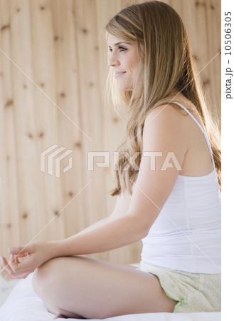 Woman practicing yoga in spa Woman practicing yoga in spa 10506305