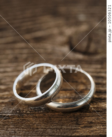 Two wedding rings on wooden table Two wedding rings on wooden table 10506321